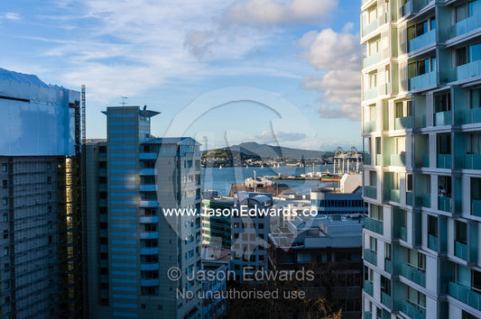Apartment complexes crowd a waterfront and harbour district. Waterloo Quadrant, Auckland, New Zealand.