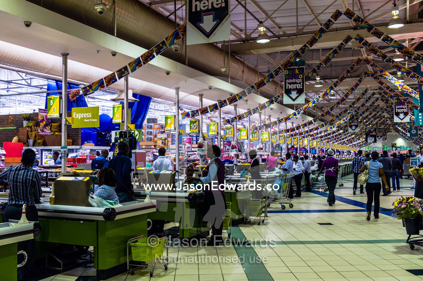 An enormous row of check-out cash registers in a supermarket mall. Menlyn Park, Pretoria, Menlyn Mall, Pretoria, Gauteng Province, South Africa.