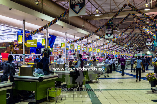 An enormous row of check-out cash registers in a supermarket mall. Menlyn Park, Pretoria, Menlyn Mall, Pretoria, Gauteng Province, South Africa.