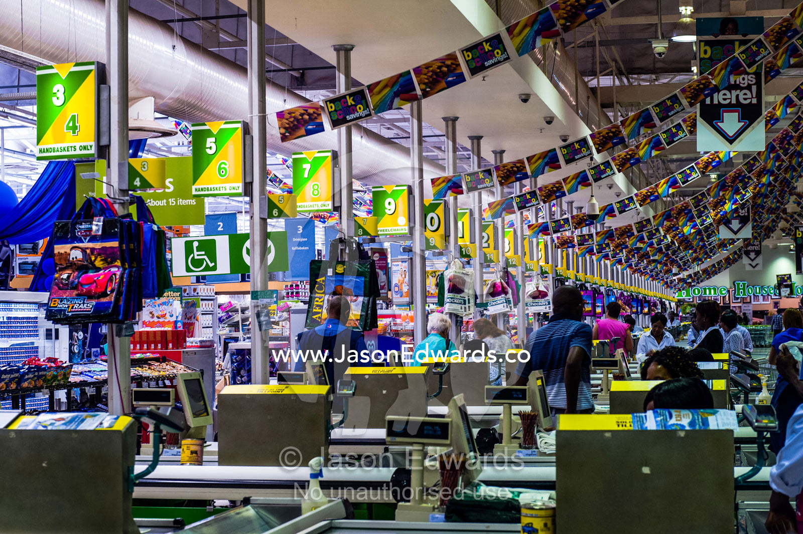 An enormous row of check-out cash registers in a supermarket mall. Menlyn Park, Pretoria, Menlyn Mall, Pretoria, Gauteng Province, South Africa.