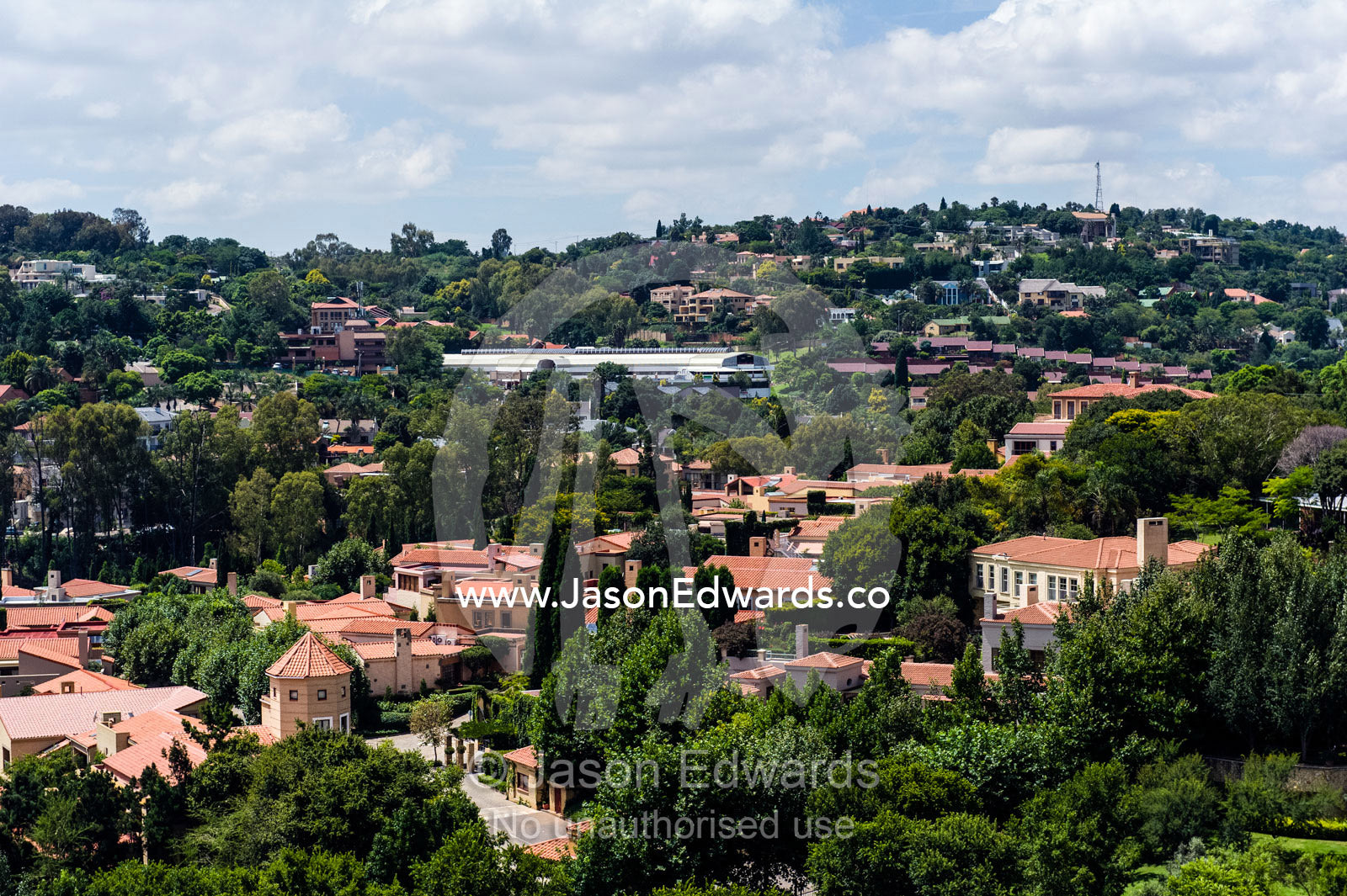 An affluent gated community suburb dotted with jacaranda trees. Waterkloof 101, Pretoria, Gauteng Province, South Africa.