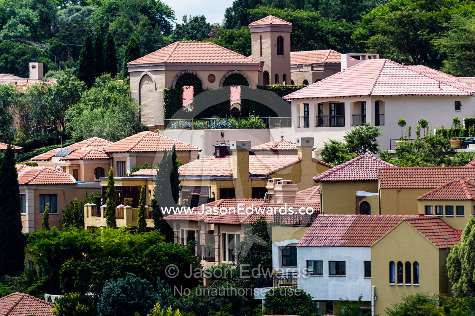 An affluent gated community suburb dotted with jacaranda trees. Waterkloof 101, Pretoria, Gauteng Province, South Africa.