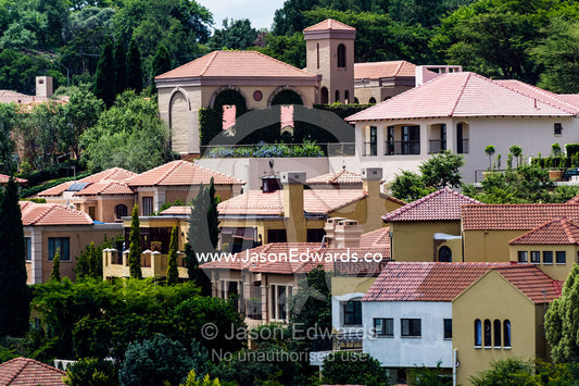 An affluent gated community suburb dotted with jacaranda trees. Waterkloof 101, Pretoria, Gauteng Province, South Africa.