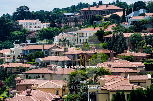 An affluent gated community suburb dotted with jacaranda trees. Waterkloof 101, Pretoria, Gauteng Province, South Africa.