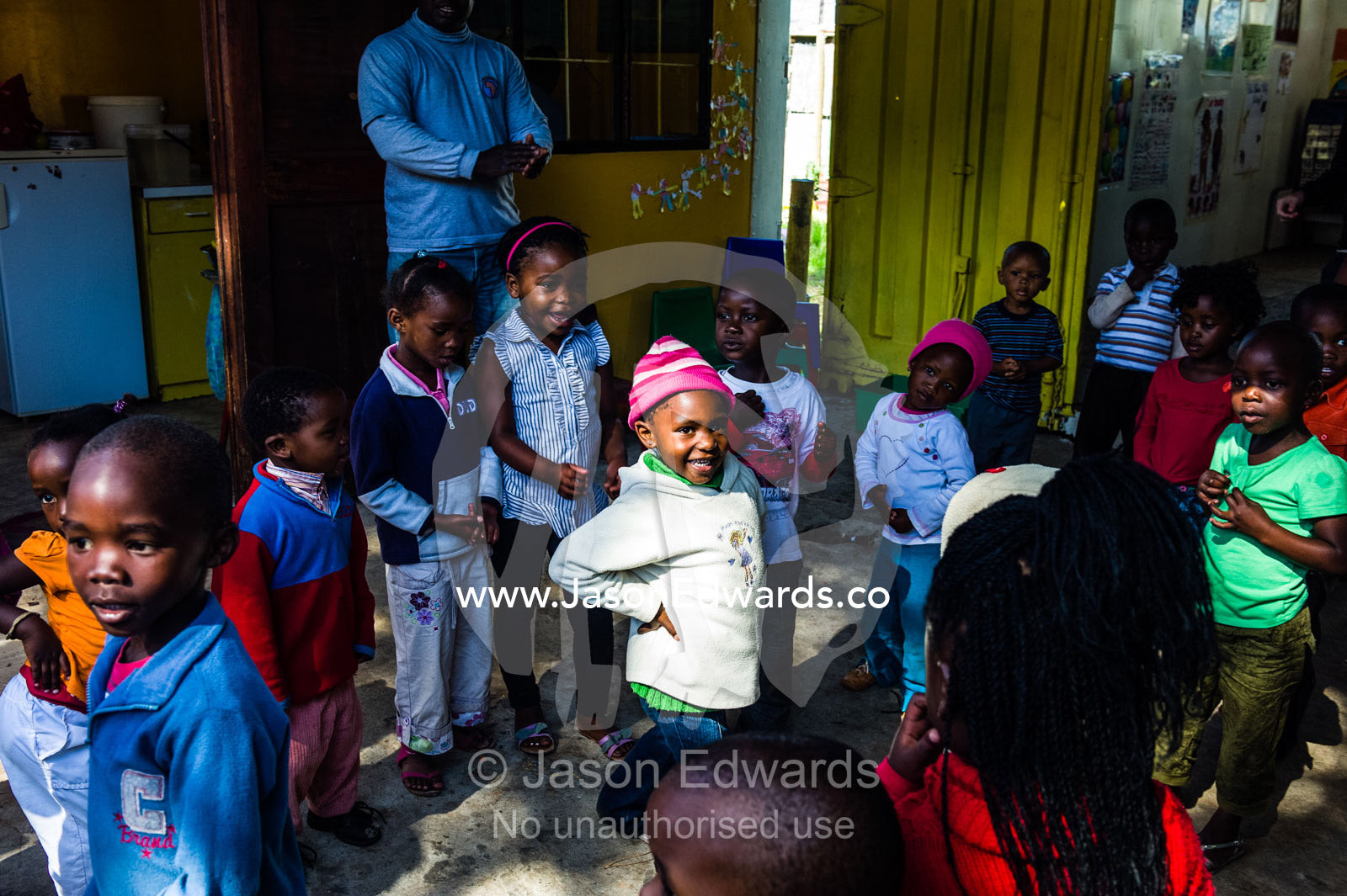 Children dance to African music during a break from classes at school. Red Hill Township and Pre-School, Cape Town, Western Cape, South Africa.