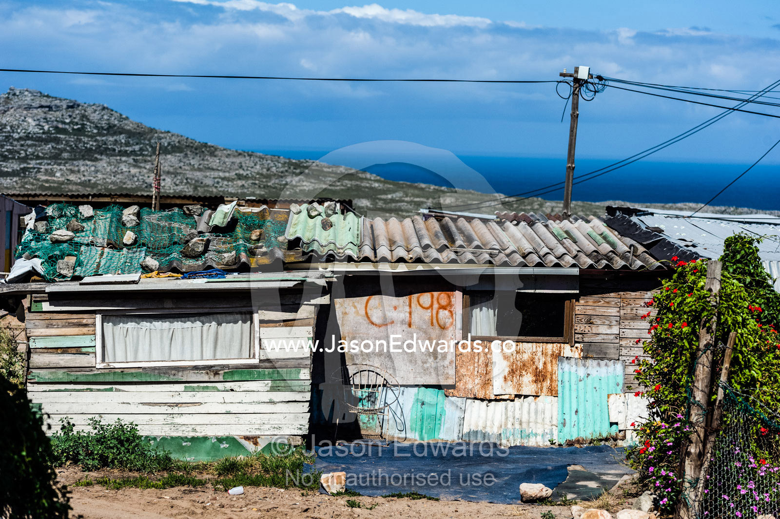 Township homes made of scrap metal for displaced African refugees. Red Hill Township and Pre-School, Cape Town, Western Cape, South Africa.