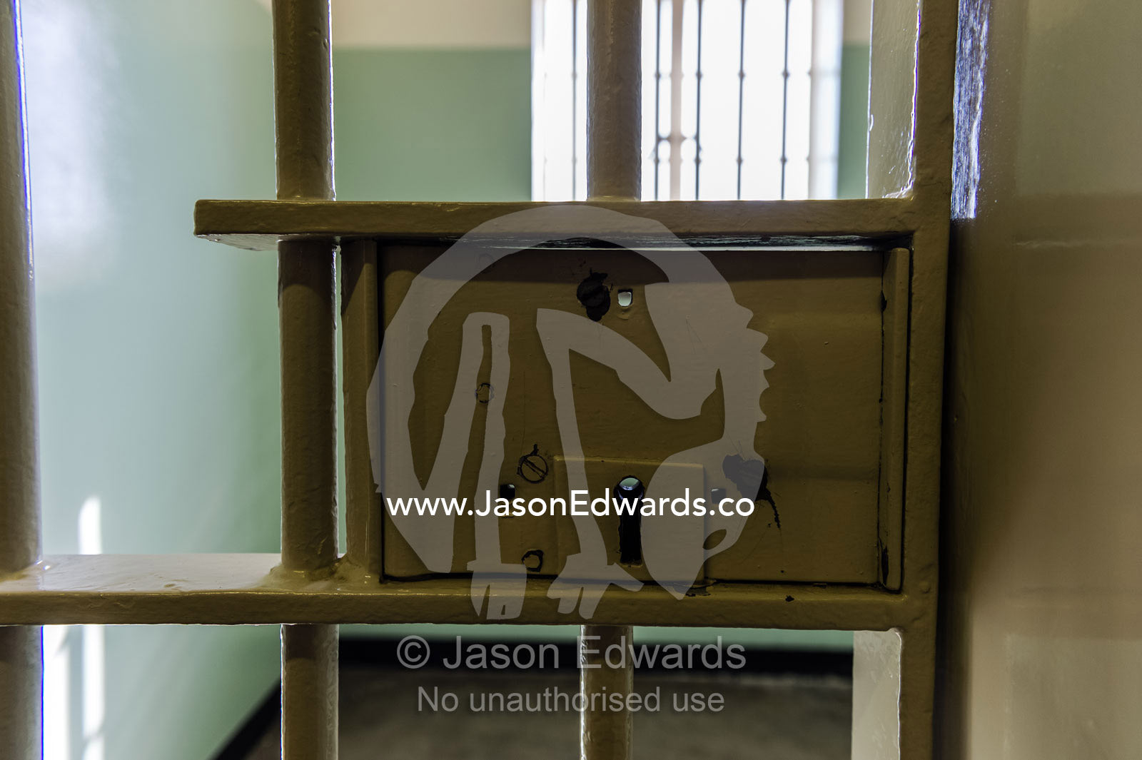 The steel bars and lock on the cell door that held Nelson Mandela. Robben Island, Cape Town, Bloubergstrand, Table Bay, Western Cape, South Africa.
