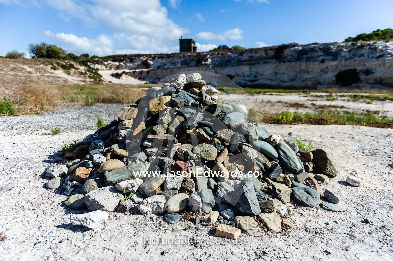 Memorial rock pile started by Nelson Mandela in a prison limestone quarry. Robben Island, Cape Town, Bloubergstrand, Table Bay, Western Cape, South Africa.