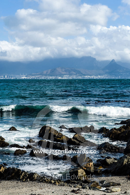 The city and suburbs of Cape Town across the Table Bay sea channel. Robben Island, Cape Town, Bloubergstrand, Table Bay, Western Cape, South Africa.