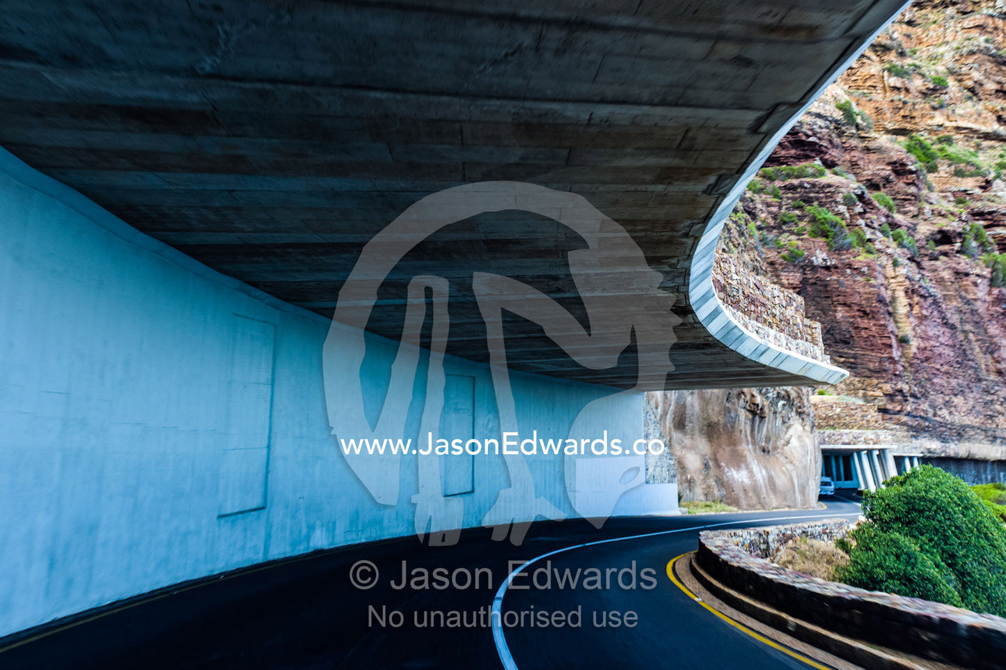 A concrete ceiling prevents avalanches from blocking a coastal road. Cape Town, Chapmans Peak Drive, Chapmans Peak, Western Cape, Cape Peninsula, South Africa.