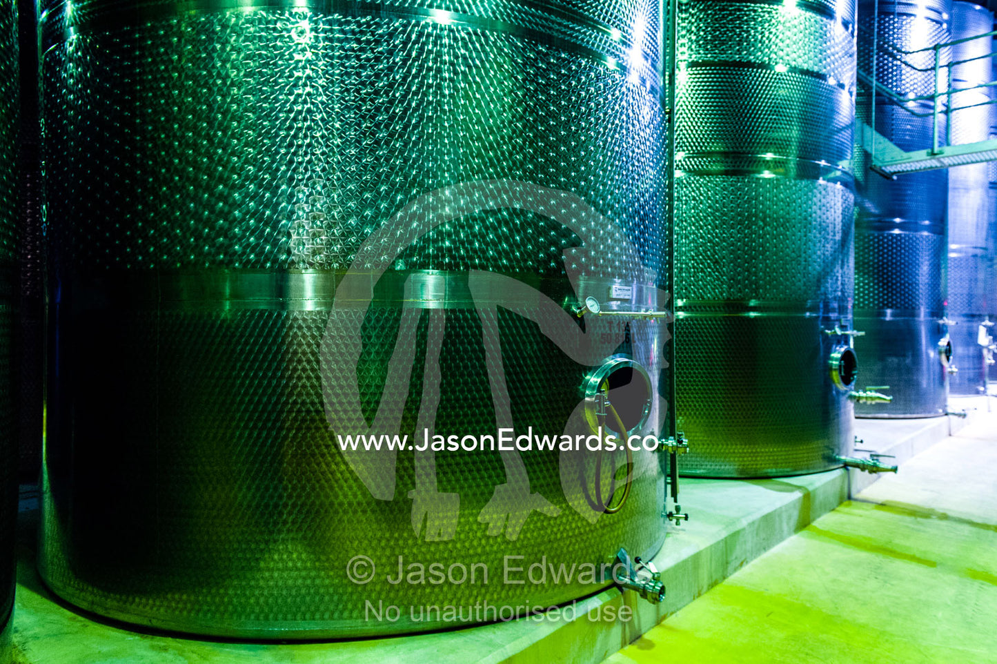 A winery uses sterile stainless steel tanks to ferment the wine. Fairview Wine Estate, Stellenbosch, Western Cape, South Africa.
