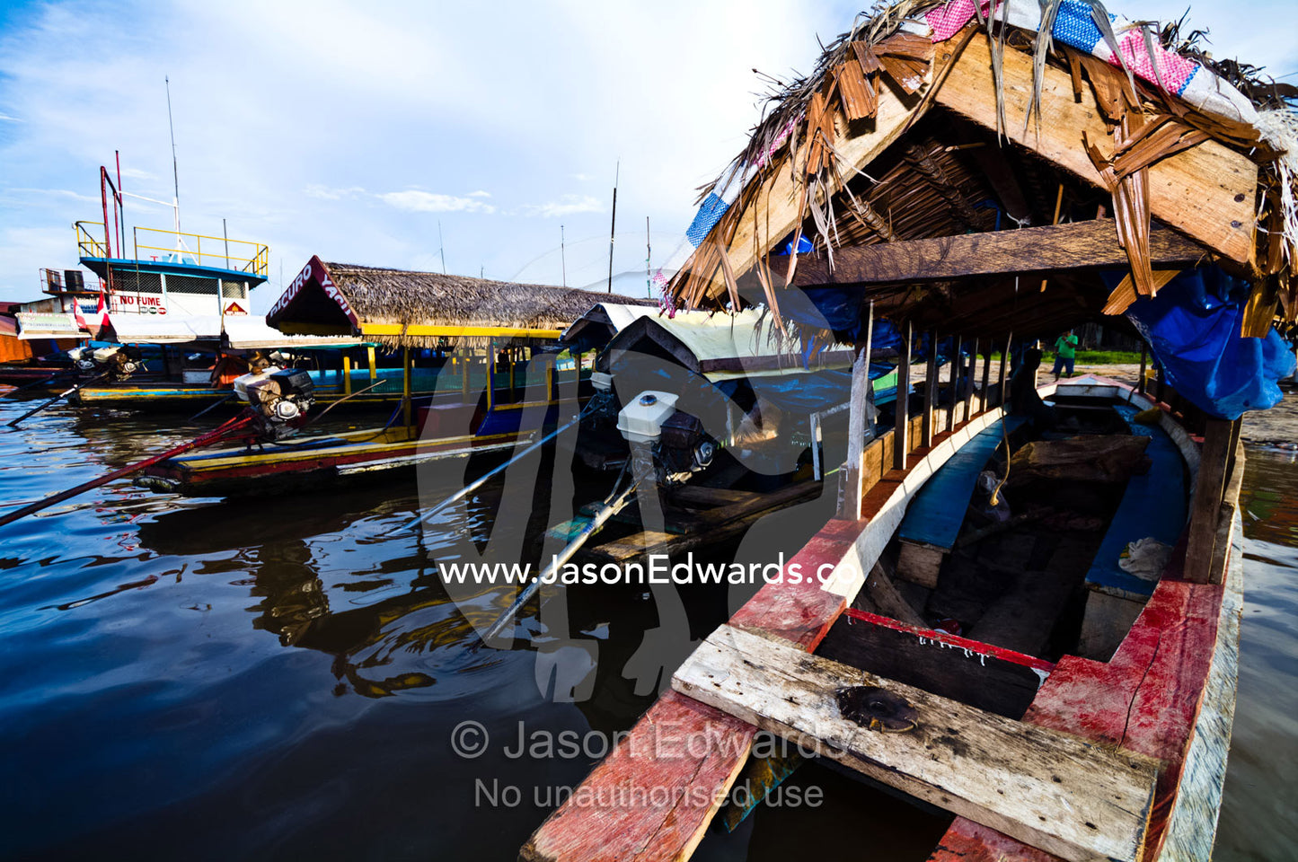 Water taxis moored along the shore of the Amazon River waiting for passengers. Iquitos, Amazon River, Rio Amazonas, Amazon Basin, Loreto Region, Maynas Province, Peru.