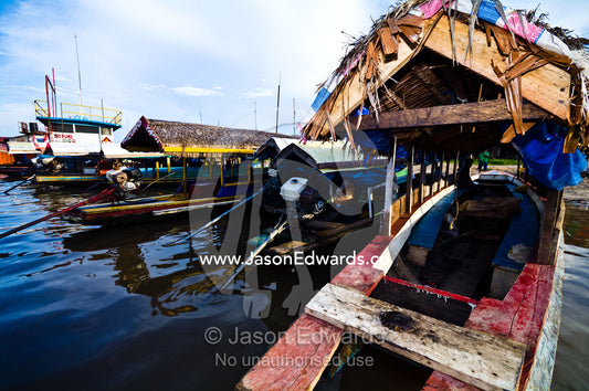 Water taxis moored along the shore of the Amazon River waiting for passengers. Iquitos, Amazon River, Rio Amazonas, Amazon Basin, Loreto Region, Maynas Province, Peru.