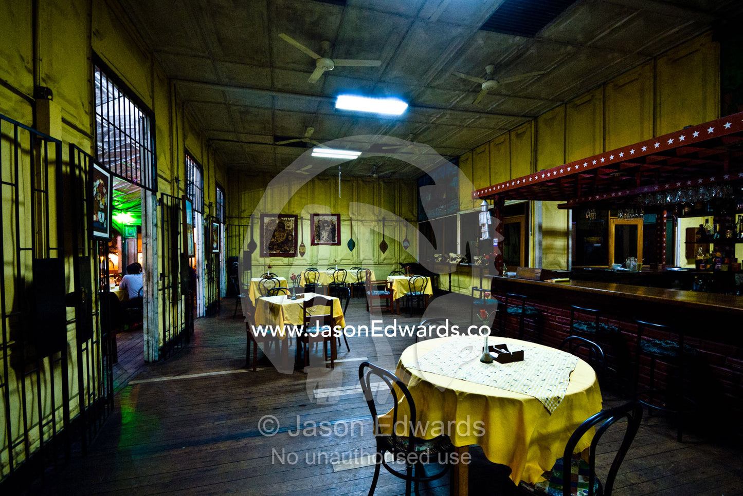 Dining tables and chairs in an antique steel restaurant in an Amazon river town. Iquitos, Amazon Basin, Loreto Region, Maynas Province, Peru.