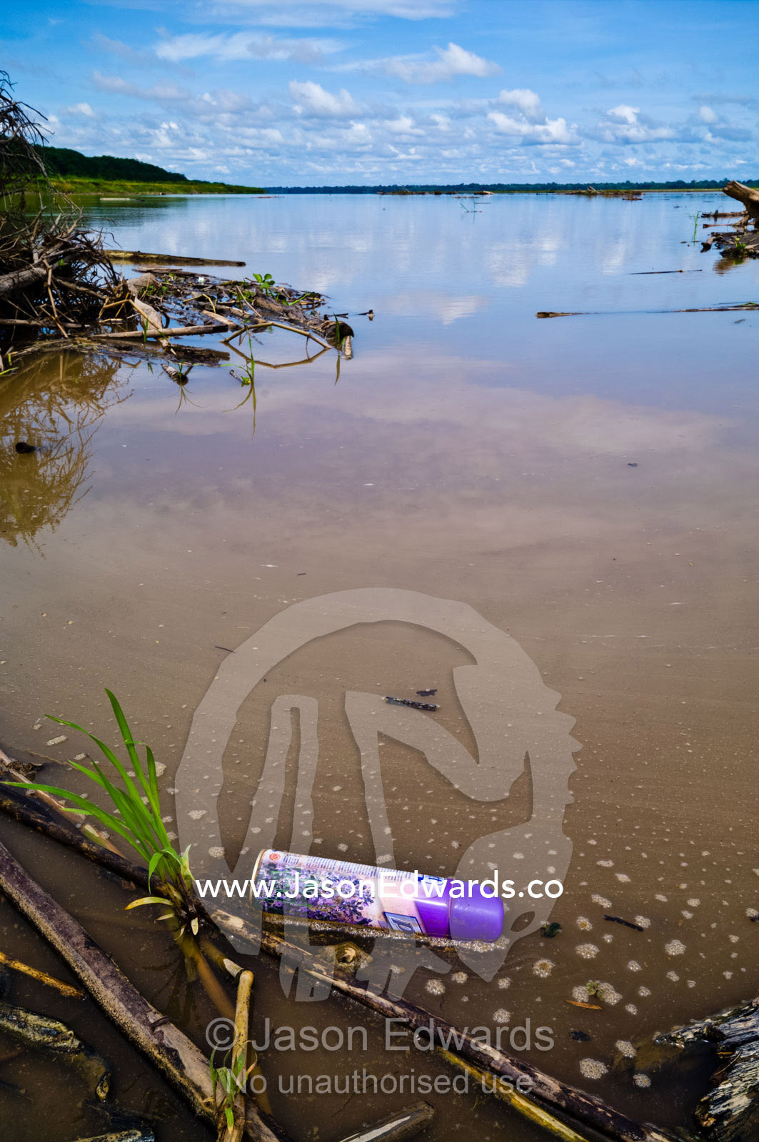 An aerosol spray can polluting the waters of the Amazon River. Amazon River, Rio Amazonas, Amazon Basin, Loreto Region, Maynas Province, Peru.