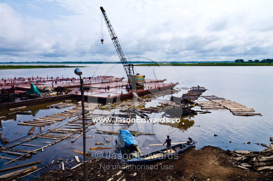 Empty logging mill barges moored on the shore of the Amazon river waiting to collect more trees. Puerto Masusa, Iquitos, Amazon River, Rio Amazonas, Amazon Basin, Loreto Region, Maynas Province, Peru.