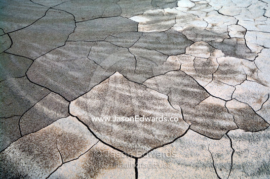 Drought and deforestation reek havoc on water levels in the Amazon River exposing sandbars and cracking the mud. Amazon Basin, Loreto Region, Maynas Province, Peru.