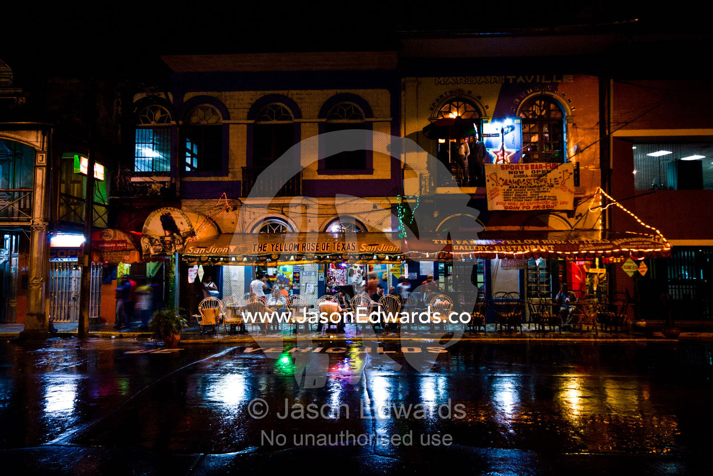 The flamboyant facade of a restaurant frequented by western travellers in an Amazonian river town. The Yellow Rose of Texas Restaurant, Iquitos, Amazon Basin, Loreto Region, Maynas Province, Peru.