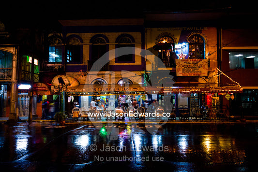The flamboyant facade of a restaurant frequented by western travellers in an Amazonian river town. The Yellow Rose of Texas Restaurant, Iquitos, Amazon Basin, Loreto Region, Maynas Province, Peru.