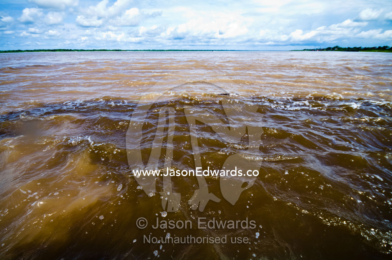 The different water colours at the confluence of two rivers carrying different sediment loads and different densities. Amazon River and Nanay River Confluence, Rio Amazonas, Rio Nanay, Loreto Region, Maynas Province, Amazon Basin, Peru.