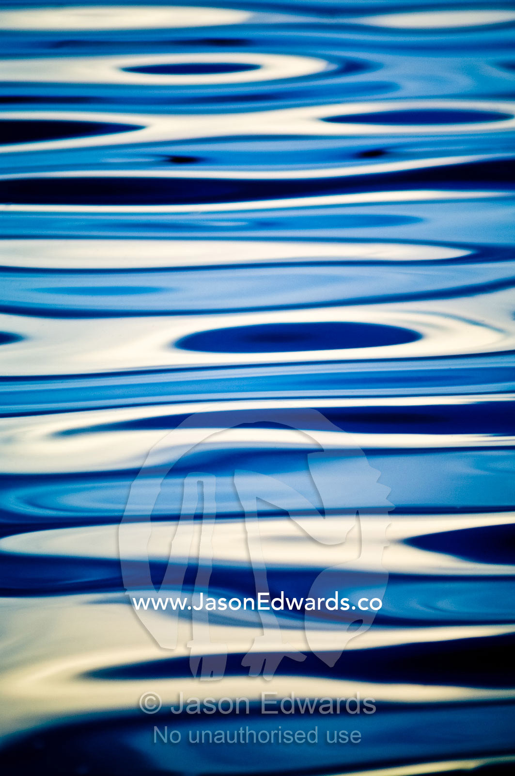 White thunderhead clouds reflected in the surface ripples of a blue lake in the Amazon rainforest. Quistococha Lake, Lago de Quistococha, Parque de Quistococha, Quistococha Zoo, Iquitos, Amazon Basin, Loreto Region, Maynas Province, Peru.