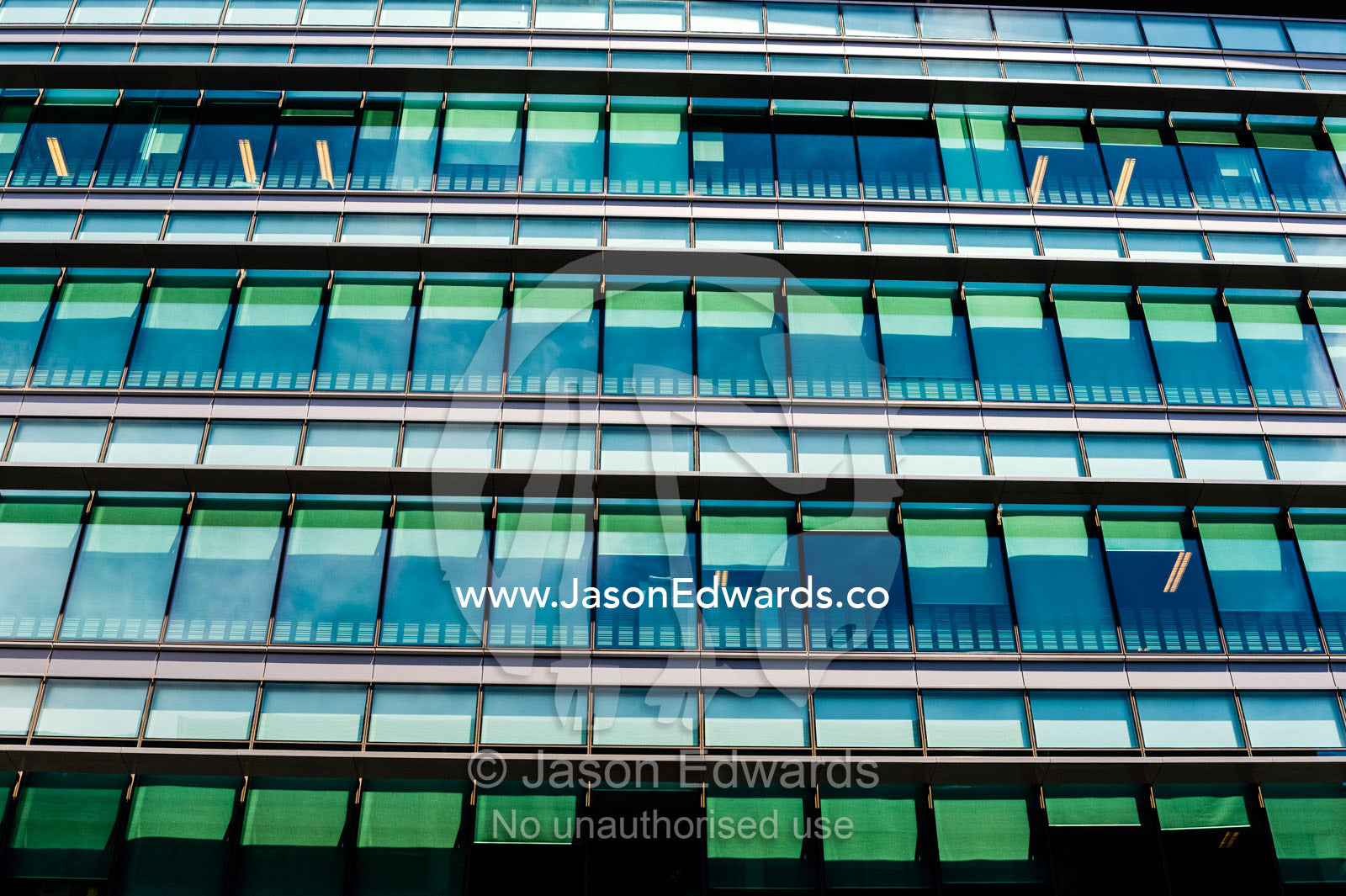 The glass and steel facade of a government corporate office building. Canberra, ACT, Australian Capital Territory, Australia.