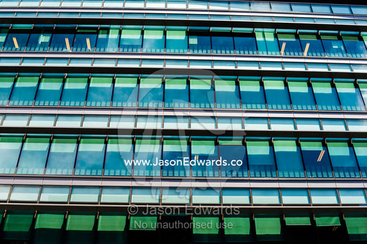 The glass and steel facade of a government corporate office building. Canberra, ACT, Australian Capital Territory, Australia.