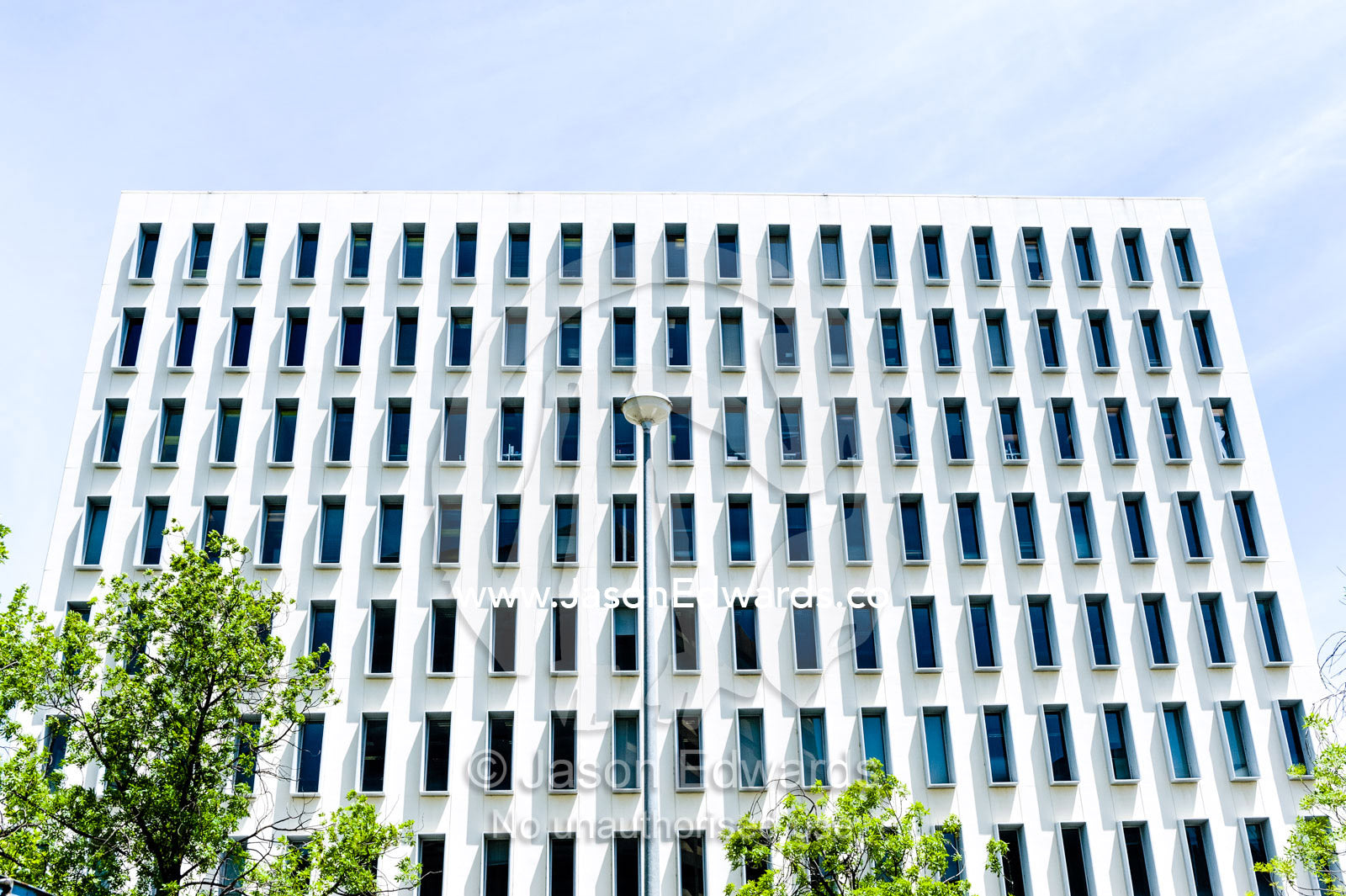 Rectangular windows in the concrete facade of an office building. Canberra, ACT, Australian Capital Territory, Australia.