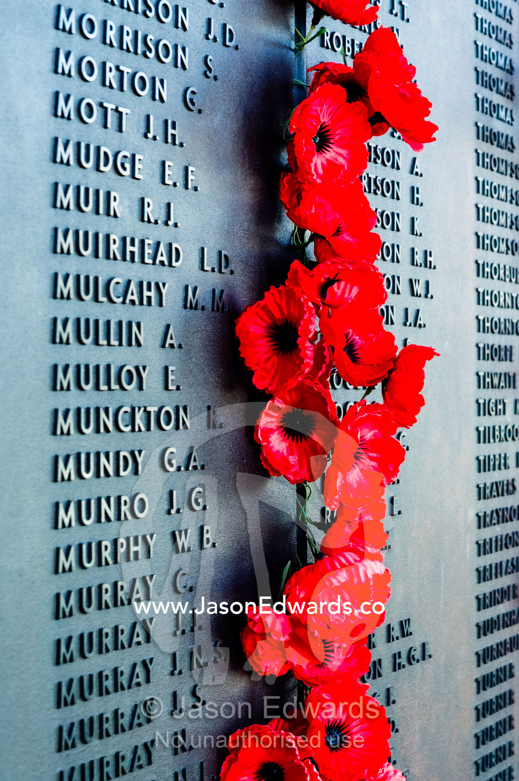 The Roll of Honour and the names of fallen soldiers remembered with bright red poppies overlook the Hall of Memory. Australian War Memorial, Canberra, Australian Capital Territory, Australia.