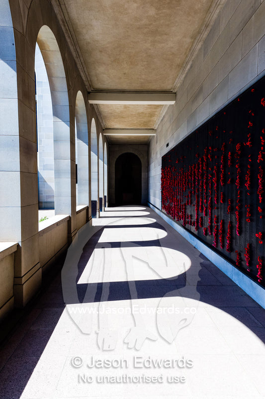 Cloisters containing the Roll of Honour and the names of fallen soldiers remembered with bright red poppies. Australian War Memorial, Canberra, Australian Capital Territory, Australia.