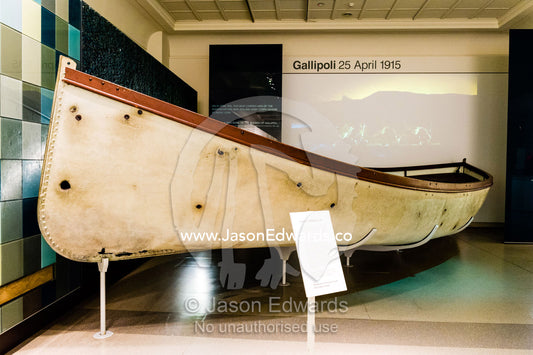 A bullet-ridden lifeboat from the Gallipoli war campaign in a museum gallery. Australian War Memorial, Canberra, Australian Capital Territory, Australia.
