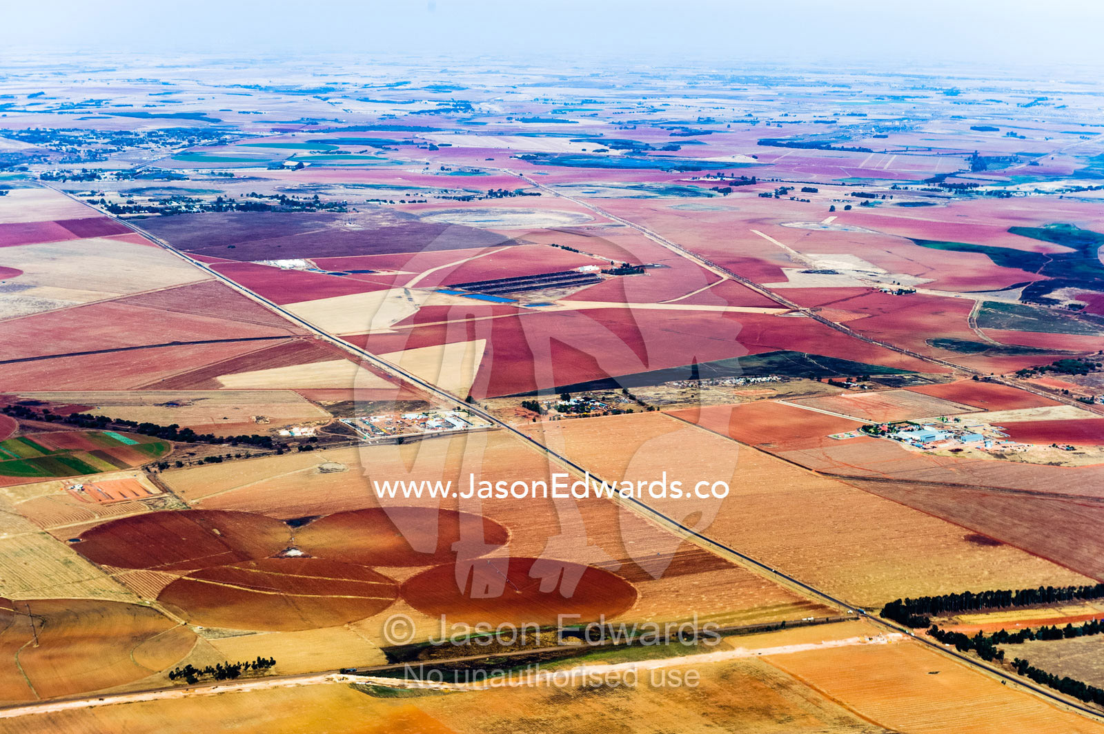 Dry and arid farmland surrounding agricultural crop circles. Johannesburg, Gauteng Province, South Africa, Africa.