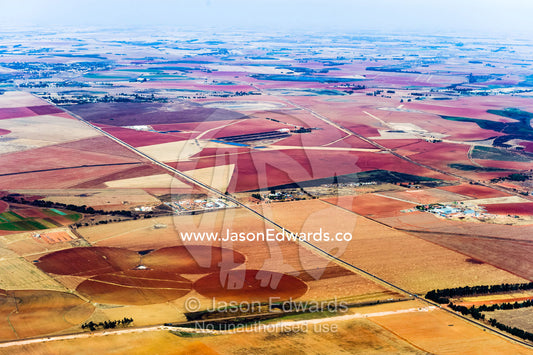 Dry and arid farmland surrounding agricultural crop circles. Johannesburg, Gauteng Province, South Africa, Africa.