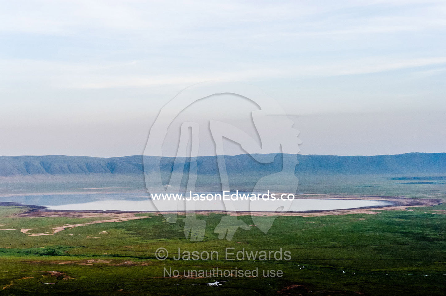 The lake on the plain of an extinct volcano surrounded by a caldera wall. Ngorongoro Crater, Ngorongoro Conservation Area, Ngorongoro District, Tanzania.