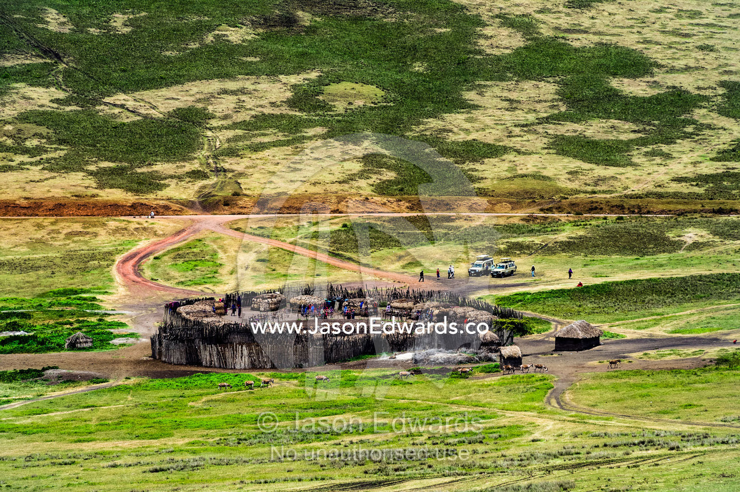 Tourists visit a Maasai boma to witness another way of life and community. Ngorongoro Crater, Ngorongoro Conservation Area, Ngorongoro District, Tanzania.