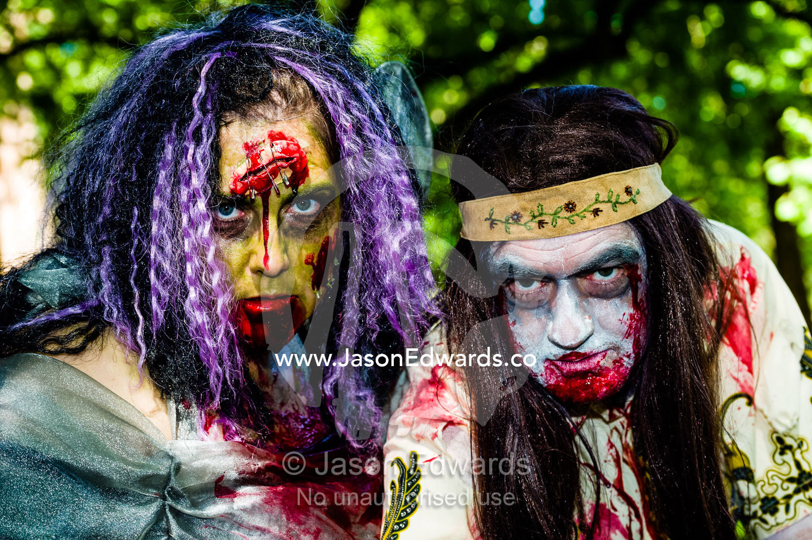 A couple dressed as blood-saoked zombies at a festival. Carlton Gardens, World Heritage Site, Carlton, Melbourne, Victoria, Australia.