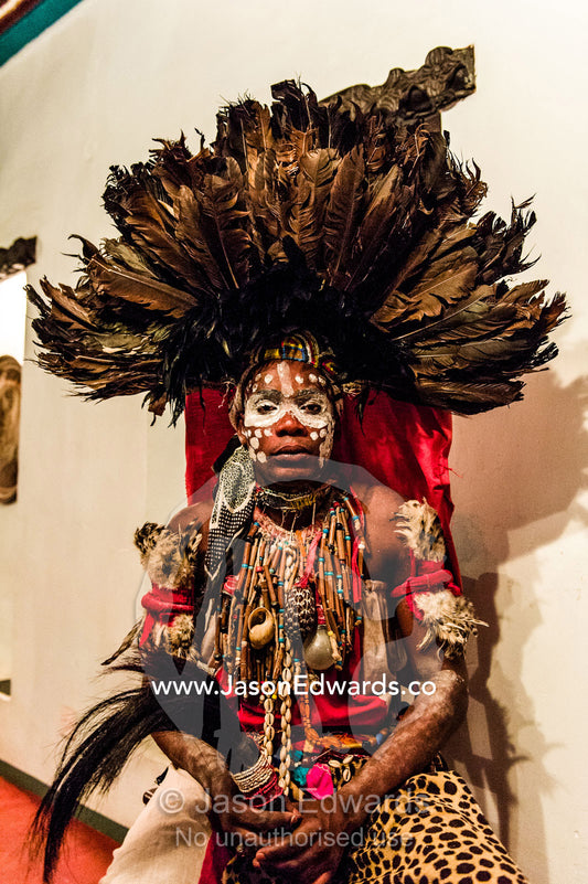 A Spirit dancer decorated in facial paint, shells, beads and a feathered headdress. Stone Town, Mji Mkongwe, Zanzibar, Unguja Island, Zanzibar, Tanzania.