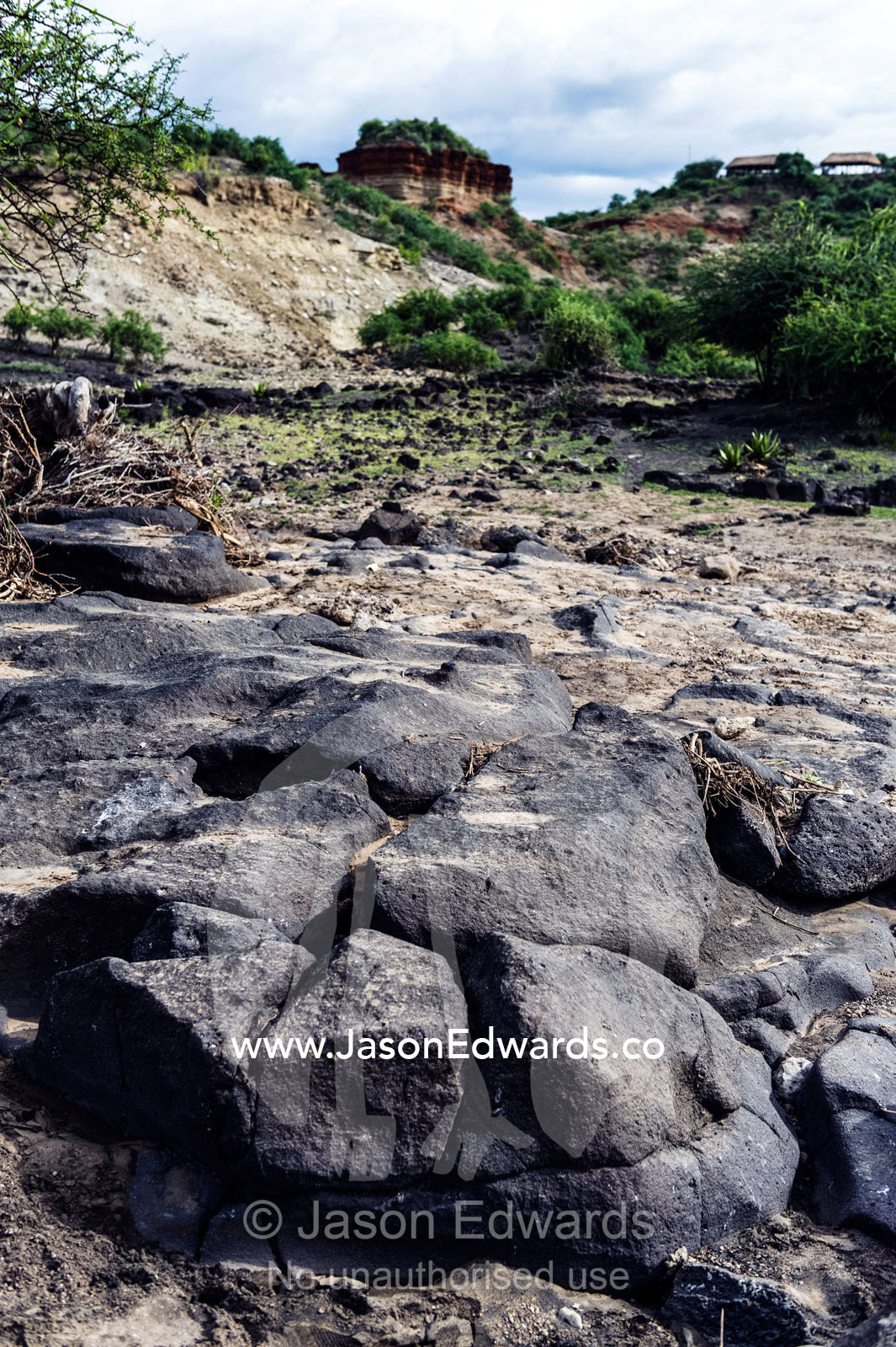 Eroded rocks in a dry river bed flowing through an arid gorge. Olduvai Gorge, Ngorongoro Conservation Area, Serengeti Plains, Arusha District, Tanzania.