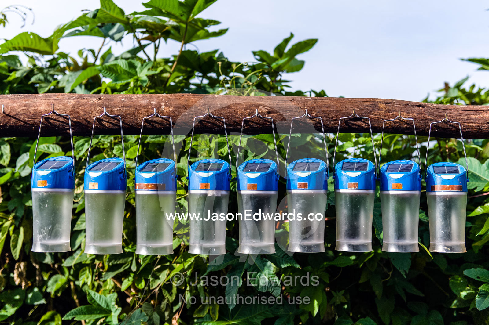Solar lanterns charging in the sun for safari lodge guests to use at night. Karatu, Rhotia Valley Lodge, Rhotia Valley, Karatu District, Arusha Region, Tanzania.