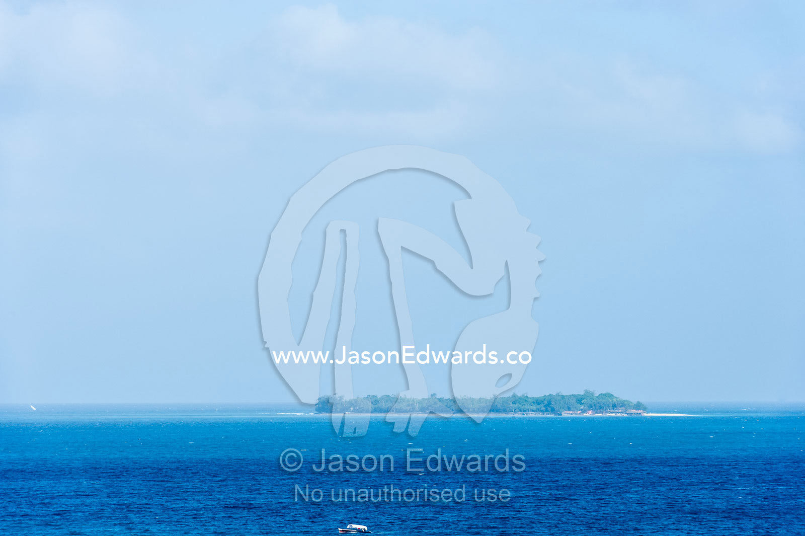 An offshore island surrounded by the blue waters of the Indian Ocean. Stone Town, Mji Mkongwe, Zanzibar, Unguja Island, Zanzibar, Tanzania.