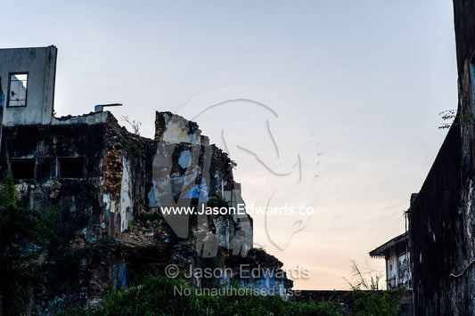 Dawn rises over the crumbling walls of a merchants house in an ancient trading port. Stone Town, Mji Mkongwe, Zanzibar, Unguja Island, Zanzibar, Tanzania.