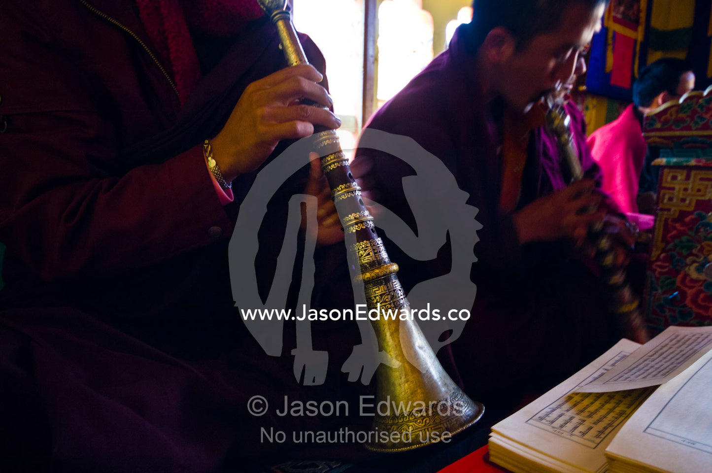 Buddhist monks read Sanskrit and play horns and flutes during a death ceremony in a private home. Ganteng, Wangdue Phodrang District, Phobjika Valley, Phobjikha Valley, Gangteng Valley, Black Mountains, Bhutan.
