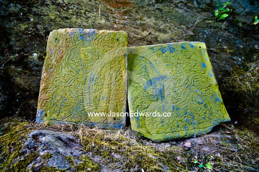 Lichen encrusted stone tablets at a Buddhist monastery featuring engravings of two bodhisattvas Cheri Monastery, Chagri Dorjeden Monastery, Thimphu, Thimphu District, Bhutan.