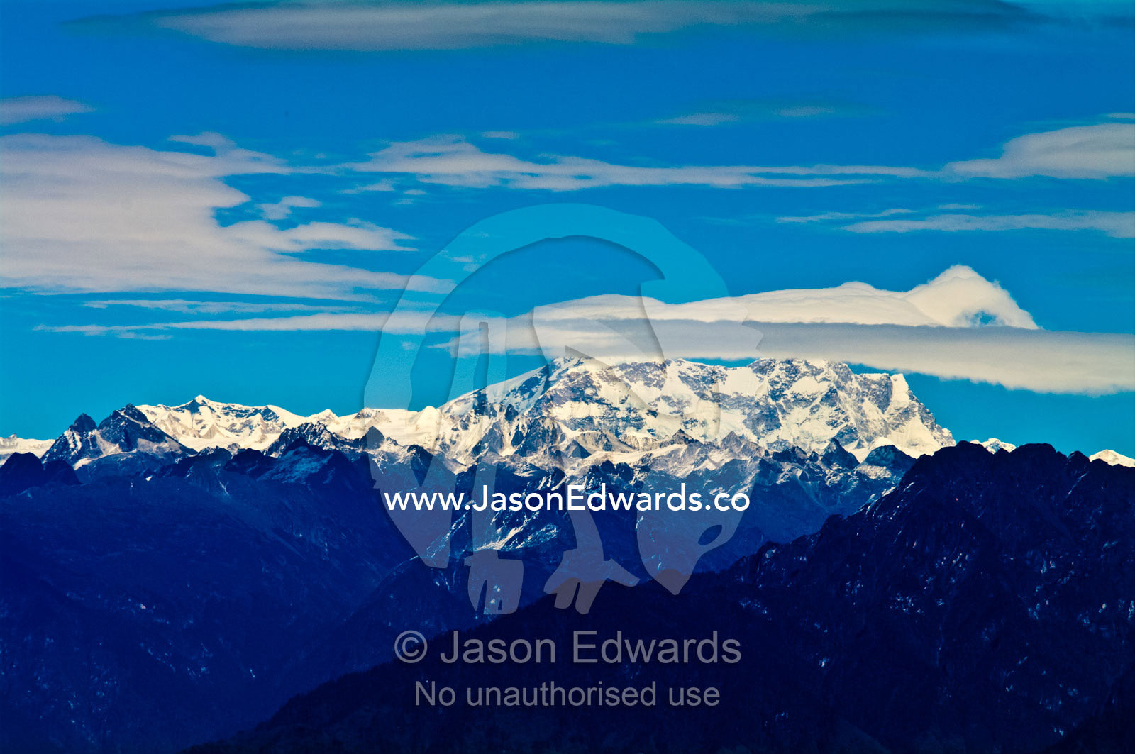 The rugged snow and ice covered peak of Mount Kula Kangri, the highest mountain in Bhutan. 108 Druk Wangyal Khangzang Chortens, Dochula Pass, Thimphu District, Bhutan.
