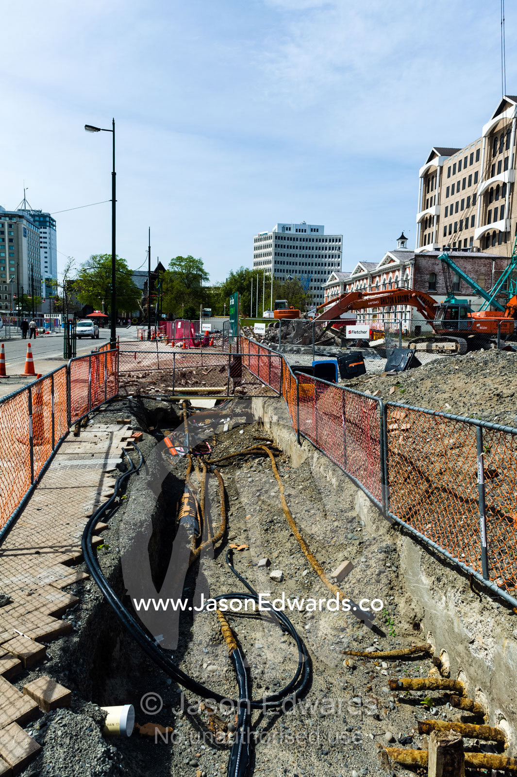 Construction on the foundations and piping of a building site where a building was destroyed by an earthquake. Christchurch, South Island, New Zealand.