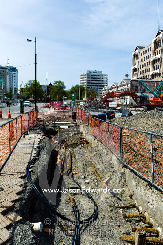 Construction on the foundations and piping of a building site where a building was destroyed by an earthquake. Christchurch, South Island, New Zealand.
