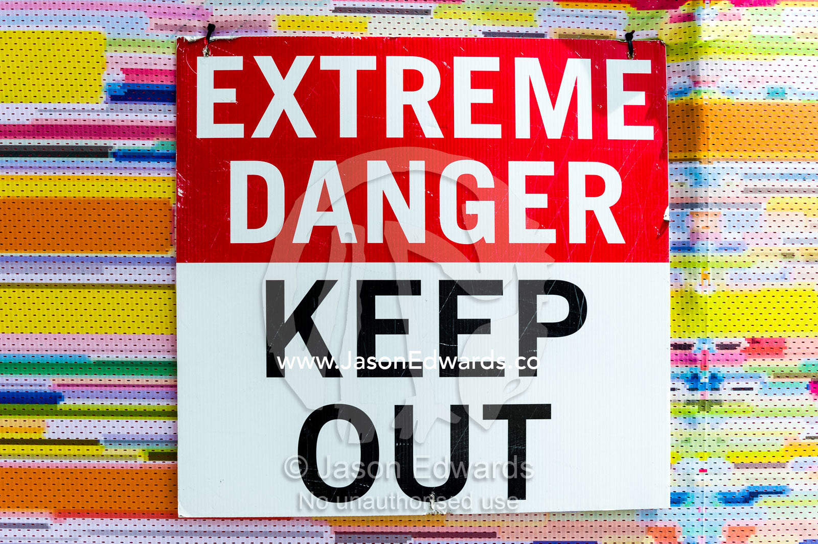 A sign warns of danger in a building that was damaged during an earthquake. Christchurch, South Island, New Zealand.