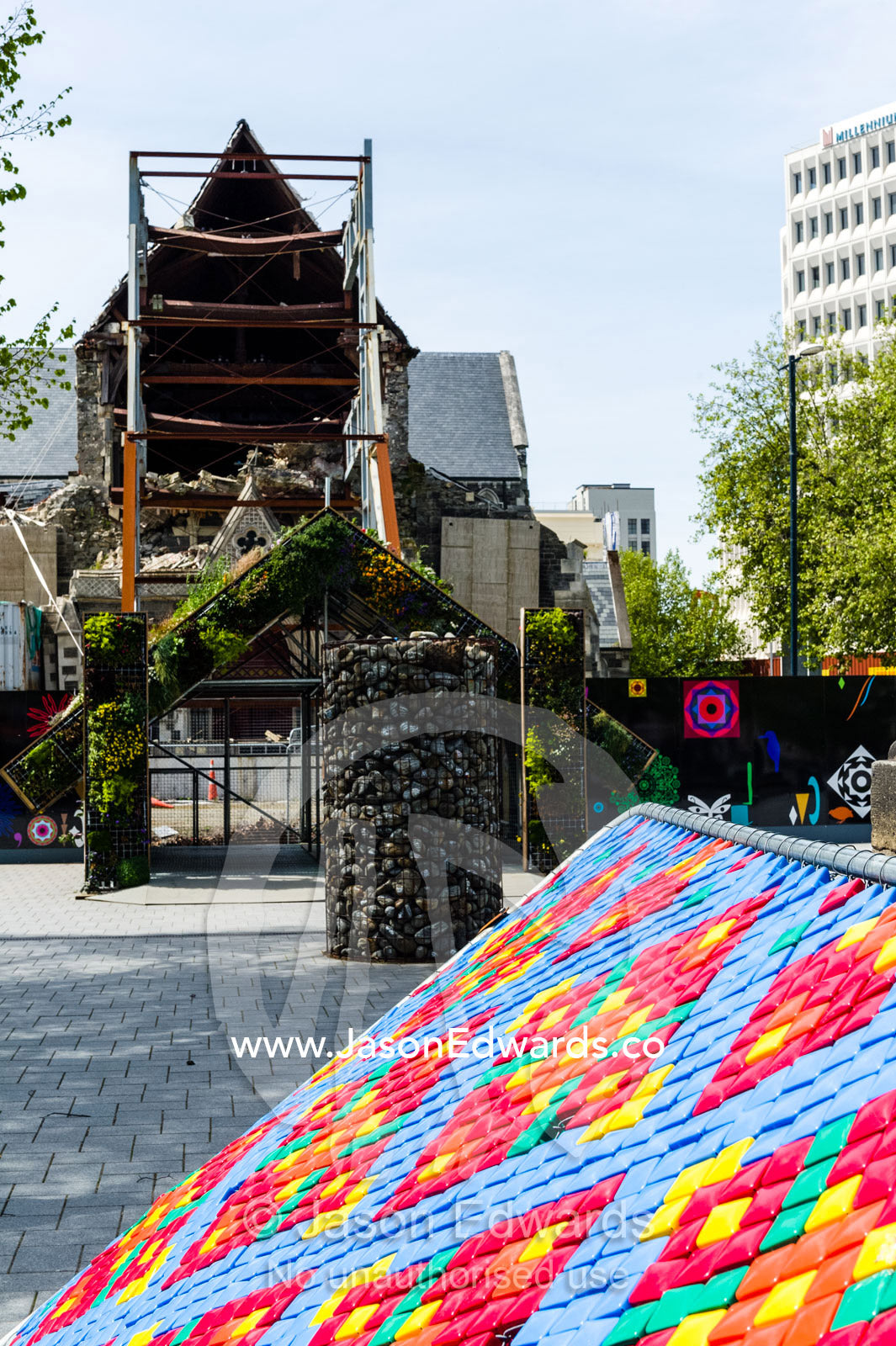 A colourful public art display near a Anglican church damaged during an earthquake. Christchurch, South Island, New Zealand.