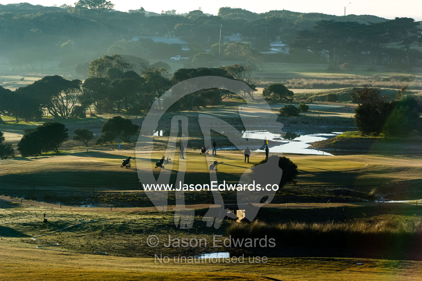 A bright sunny morning over the fairways and putting greens of a golf course by the ocean. RACV Torquay Resort, Torquay, Great Ocean Road, Surf Coast, Victoria, Australia.