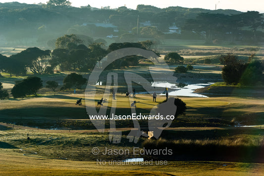 A bright sunny morning over the fairways and putting greens of a golf course by the ocean. RACV Torquay Resort, Torquay, Great Ocean Road, Surf Coast, Victoria, Australia.